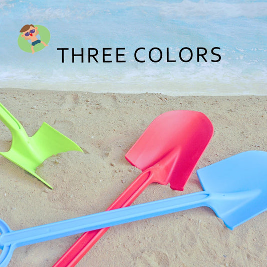Kids playing with colorful beach shovel toy set in sand outdoors