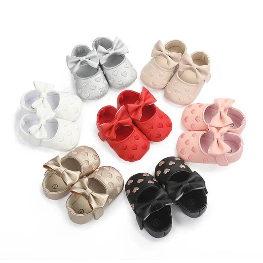 Infant hook-and-loop booties with decorative bow detail