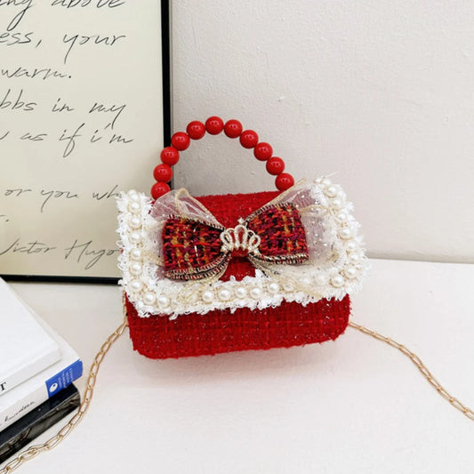 Girls' bow crossbody purse with decorative details