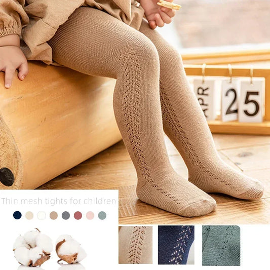 Girls' solid-color tights in assorted styles