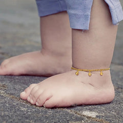 Little girl wearing adjustable charm bell beaded anklet jewelry